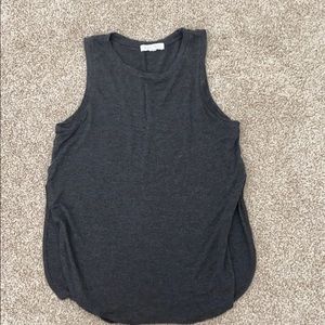 Muscle tee, slits midway up the sides.